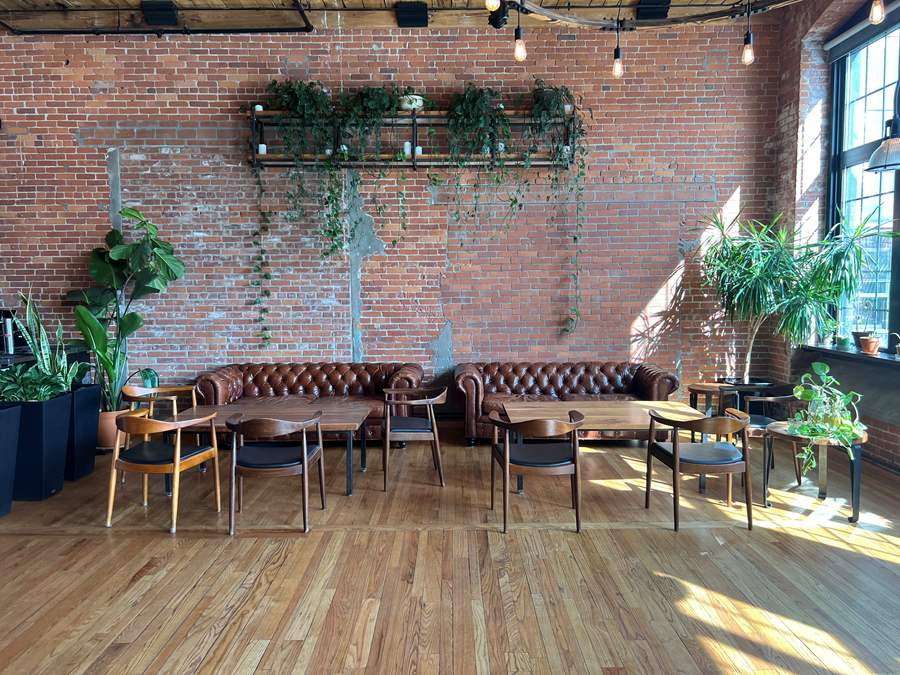 couches and chairs and plants in waterworks' river house private events space