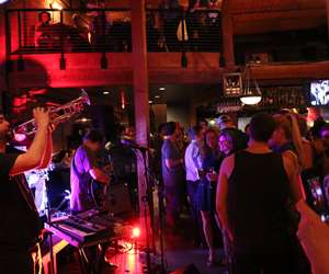 Live music: trumpet player on the left with guests on the right