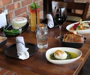 Burrata appetizer and drinks among other table settings