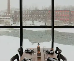 Solarium table overlooking a snowy Winooski River