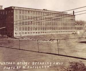 Pontoon Bridge breaking away over the Winooski River. Photo by: H Kurilchyk 1900s