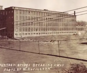 Pontoon Bridge breaking away over the Winooski River. Photo by: H Kurilchyk 1900s