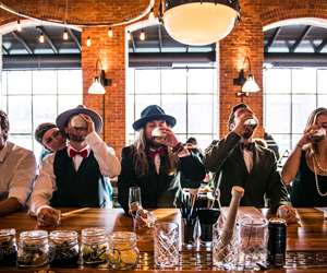 Guests taking a shot at the bar during a wedding buyout