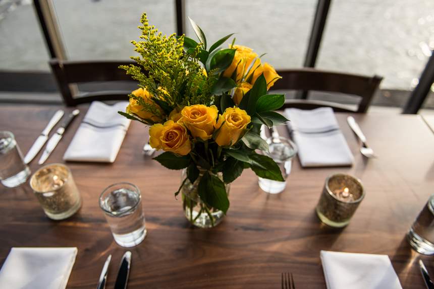Table set with a vase of flowers for an event