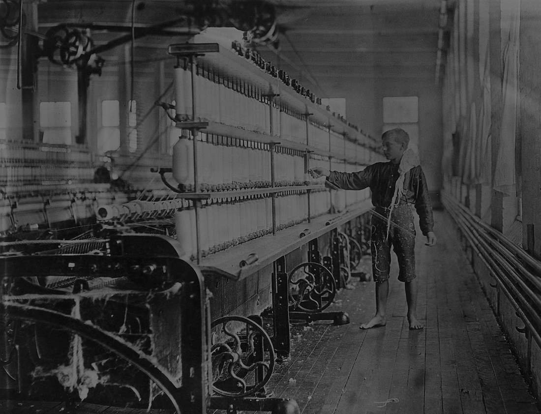 Young factory worker at Winooski Falls 1910-1915. Photo by: Lewis Hine